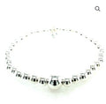 SILVER HOLLOW BALL ON ELASTIC BRACELET