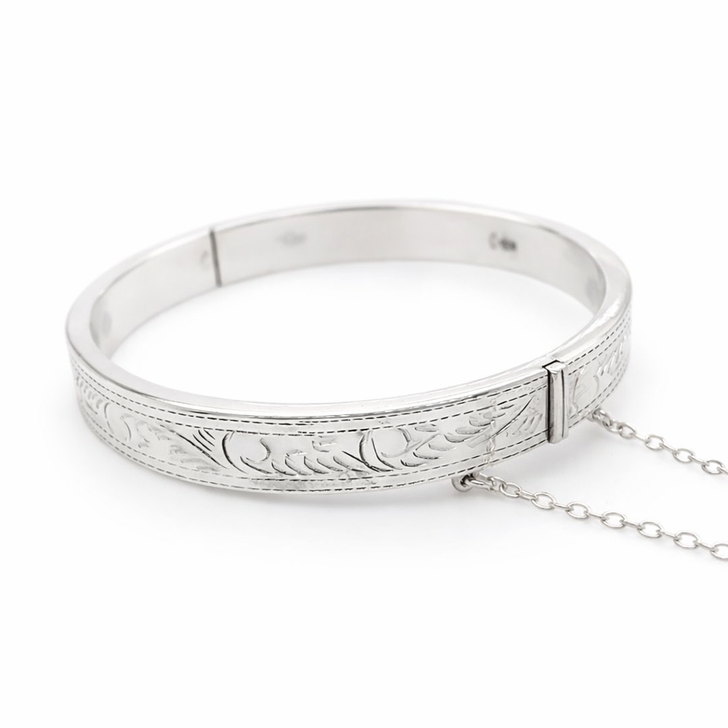 Silver hollow engraved flat hinge bangle