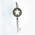 SILVER CUT OUT FLOWER MILLGRAIN KEY PENDANT